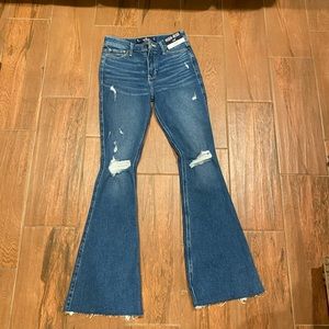 Brand new ripped flare jeans